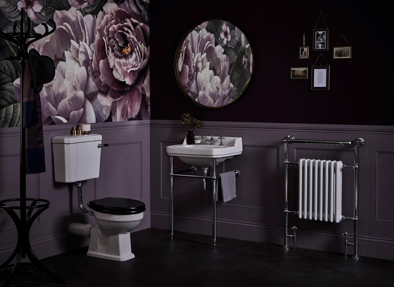 a bathroom with purple walls and a sink and a mirror