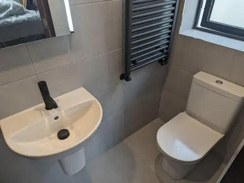 a Boden Park bathroom with a sink and toilet
