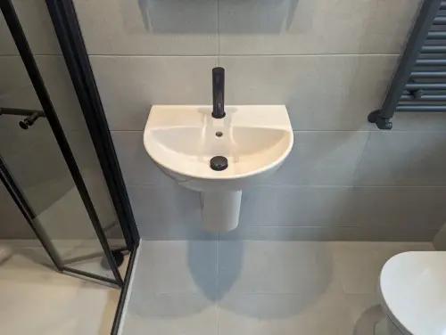 a Boden Park sink and toilet in a bathroom