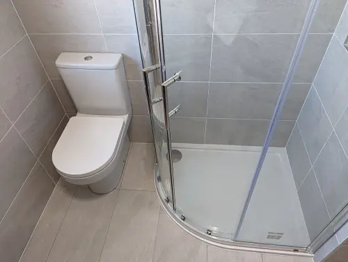 a shower and toilet in a bathroom