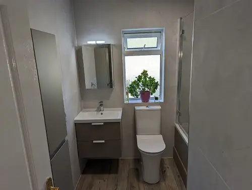 a bathroom with a sink and toilet