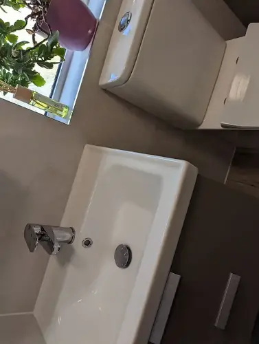 a sink and toilet in a bathroom