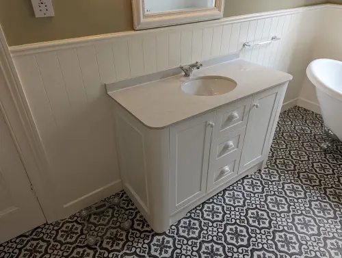 a white sink in a bathroom
